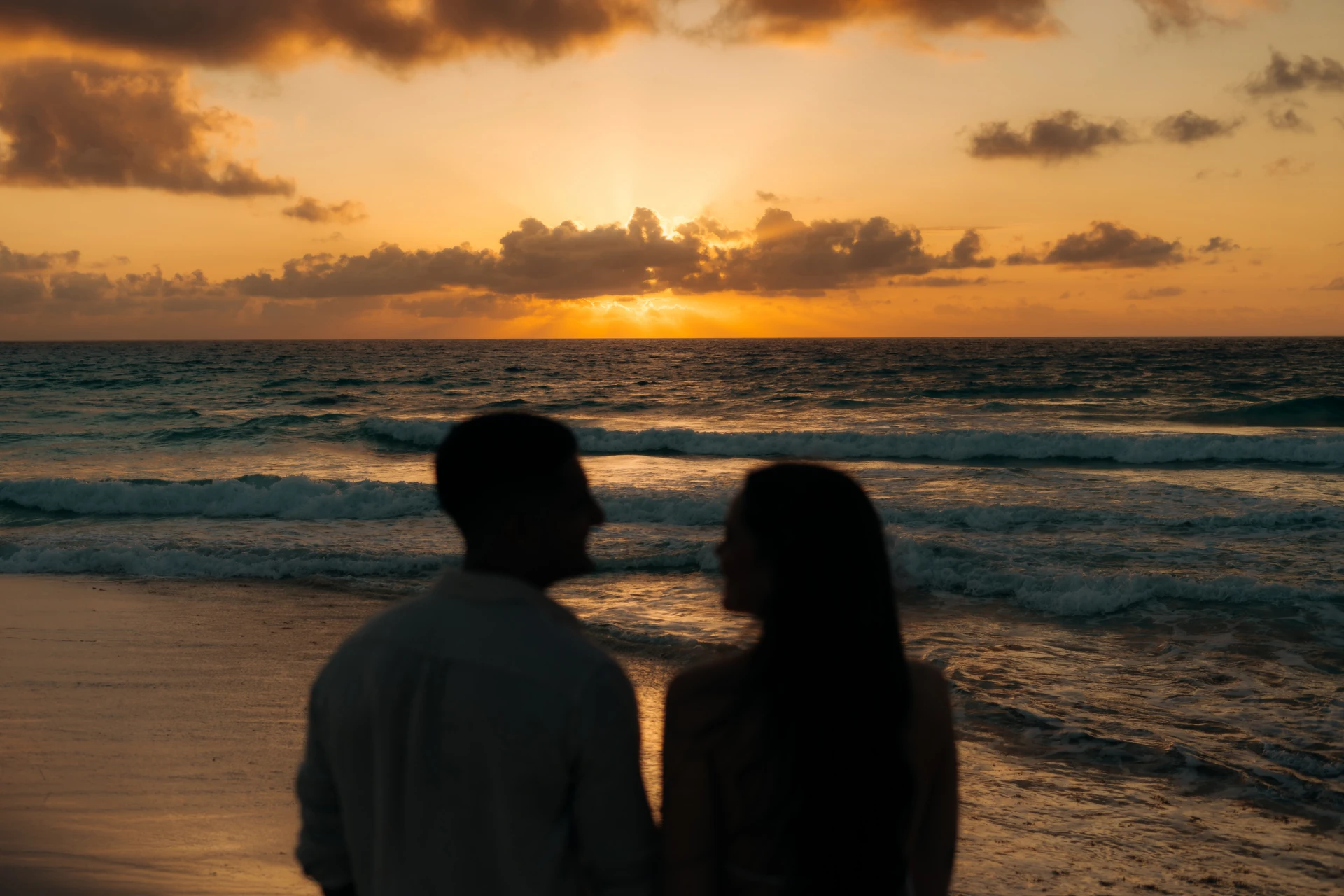 Couple silhouette at sunrise, Riviera Maya